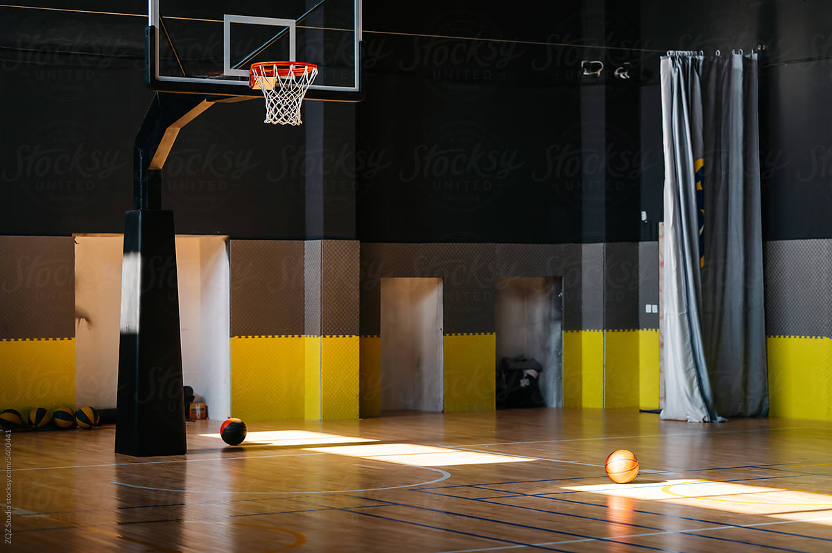 Basketball court with sunlight on the floor
