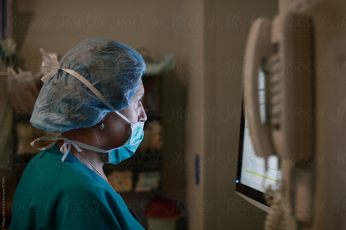 Female doctor concentrated on a screen
