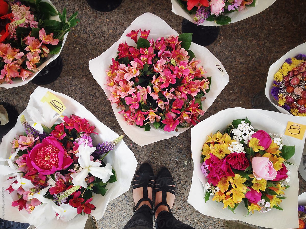 Girl\'s Feet Surrounded By Bouquets