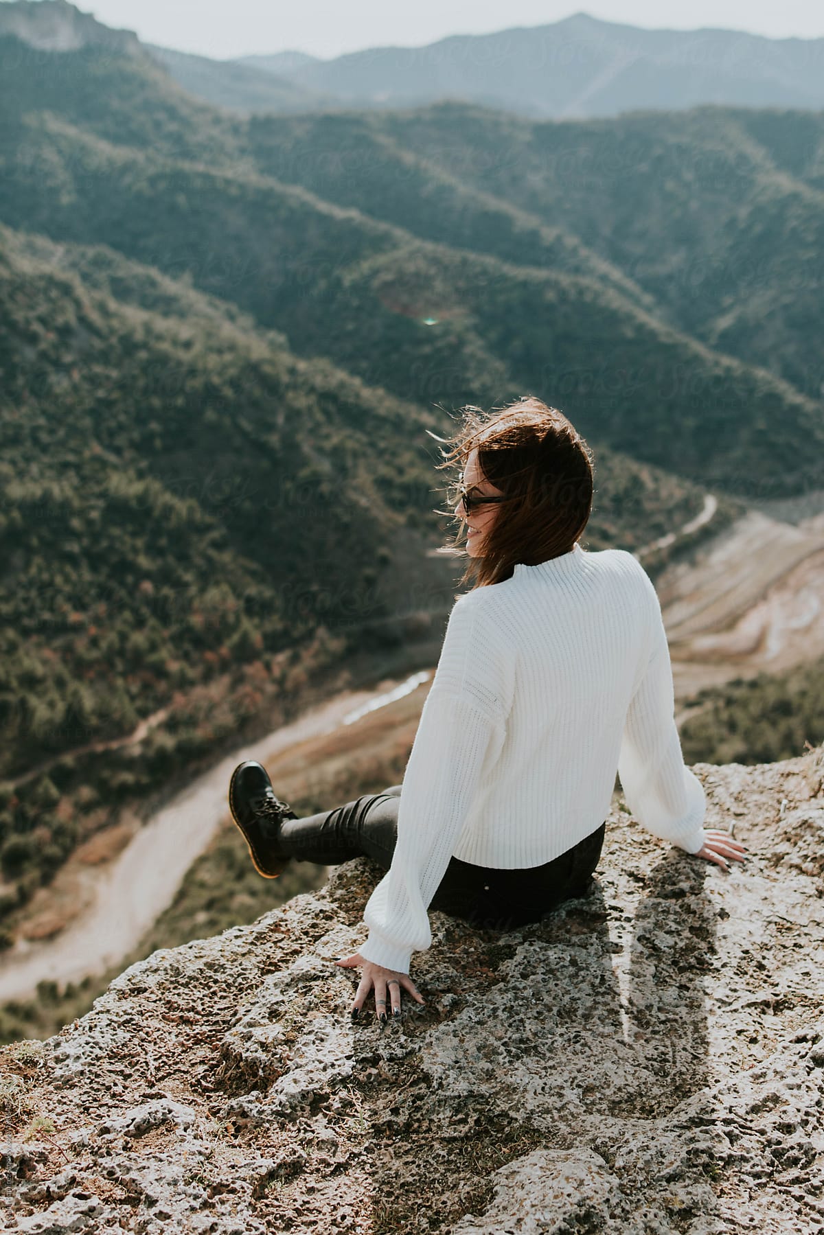 Woman Sitting On The Edge Of A Cliff Del Colaborador De Stocksy Susana Ramírez Stocksy