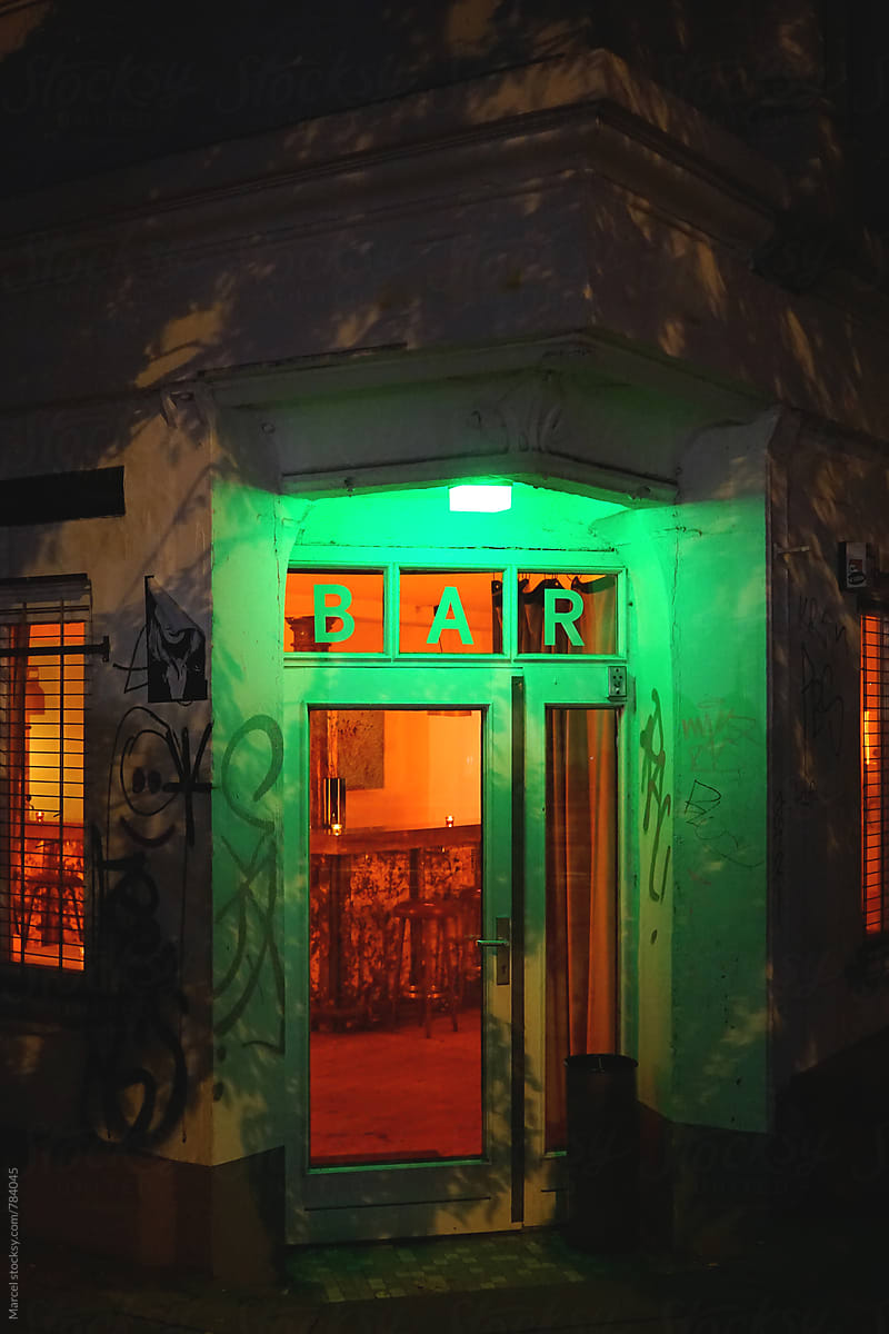 Illuminated bar entrance at night