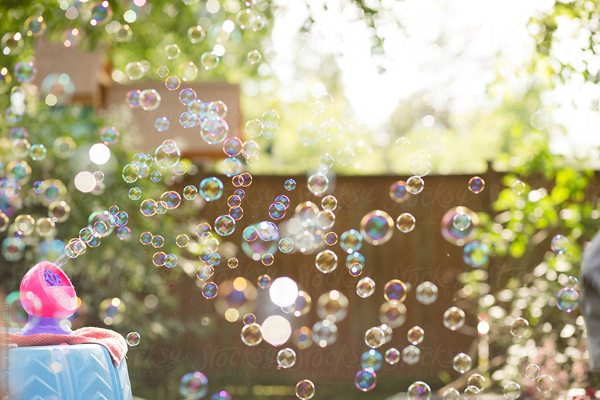 Bubble machine fills yard with bubbles