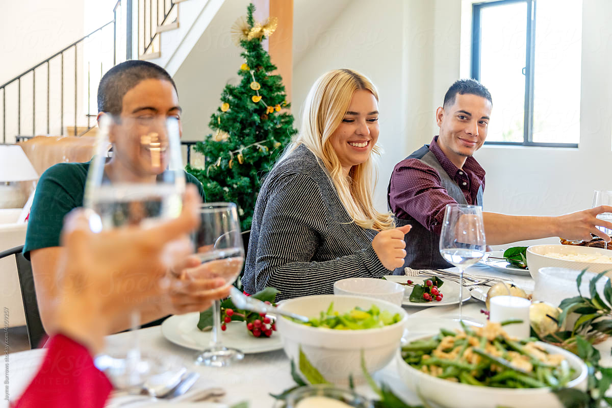 Family Gathers at Dining Table for Christmas Dinner