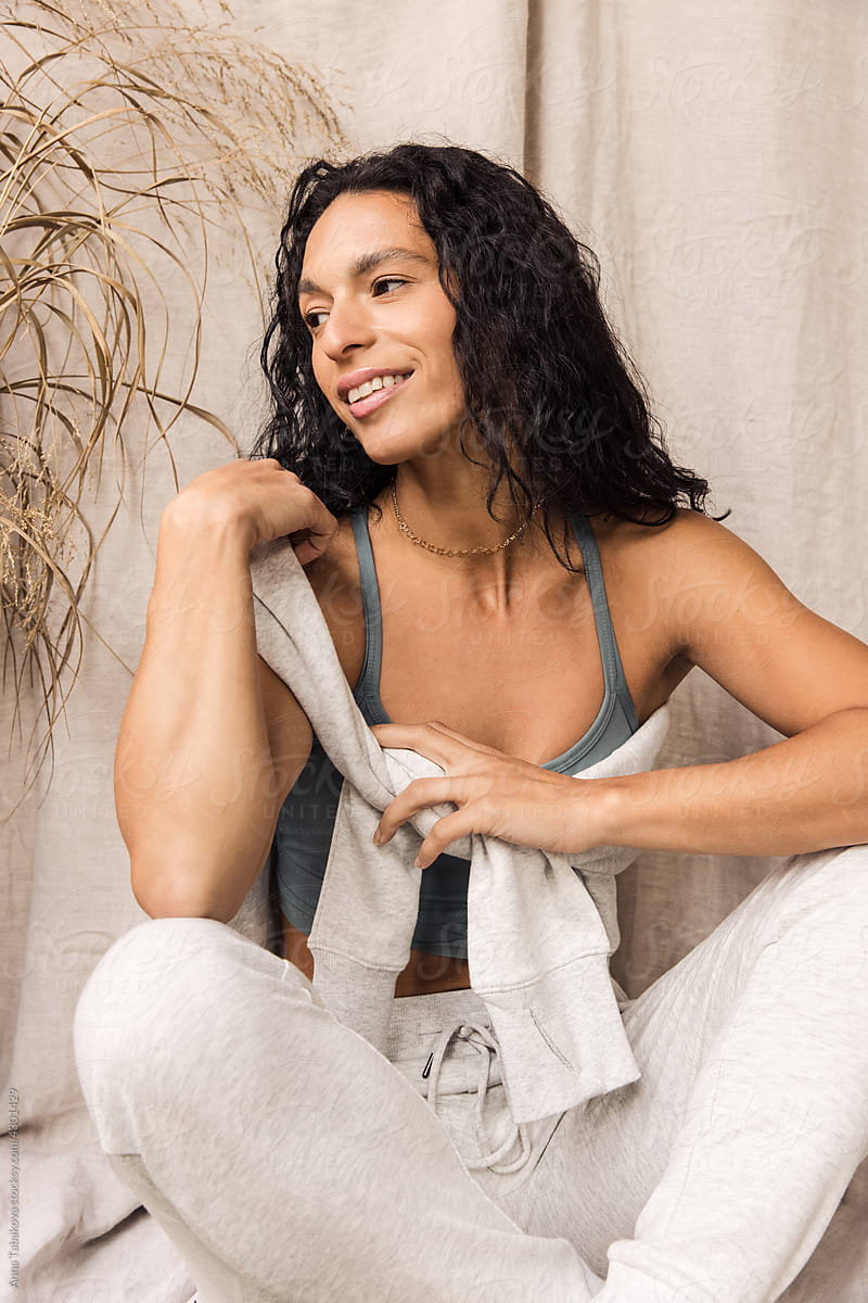 Woman in cozy white leisure set smiling