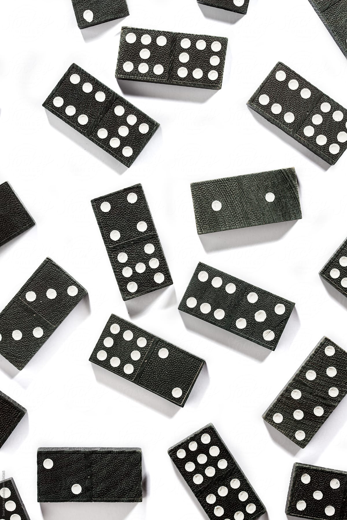 Dominoes Randomly Placed On White Background