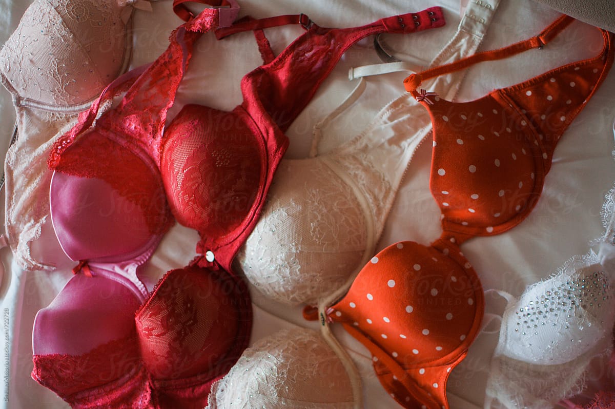 A Collection Of Bras Laying On Bed by Stocksy Contributor Chelsea  Victoria - Stocksy