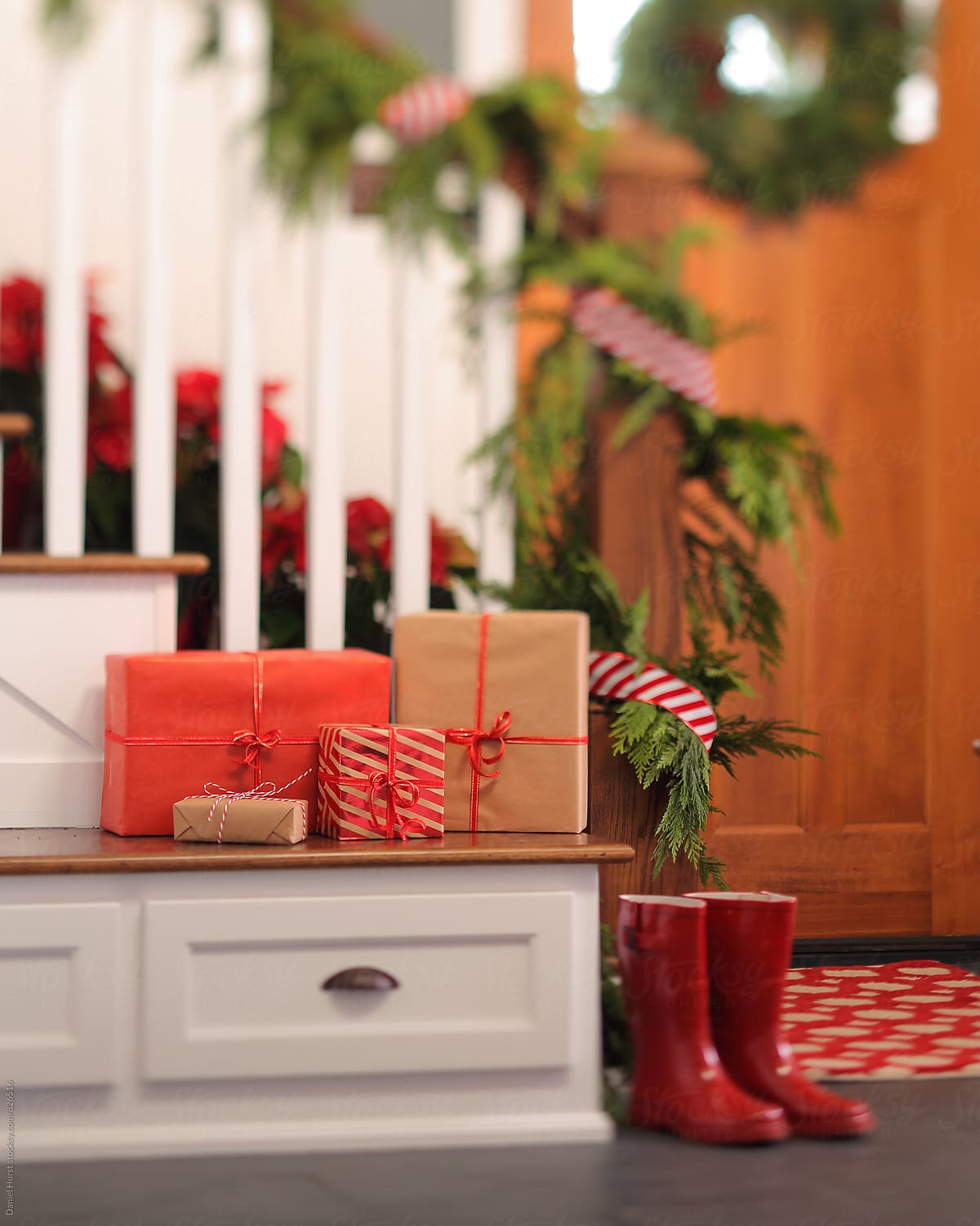 Red boots and Christmas gifts in home entry