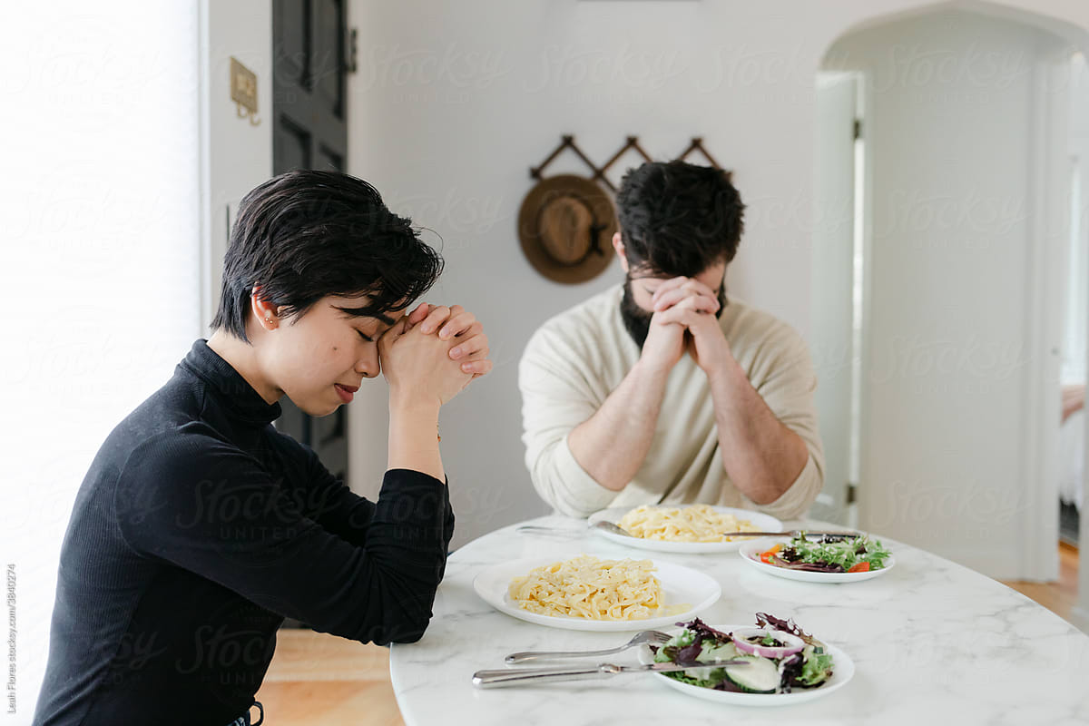 A Couple Prays before their Meal