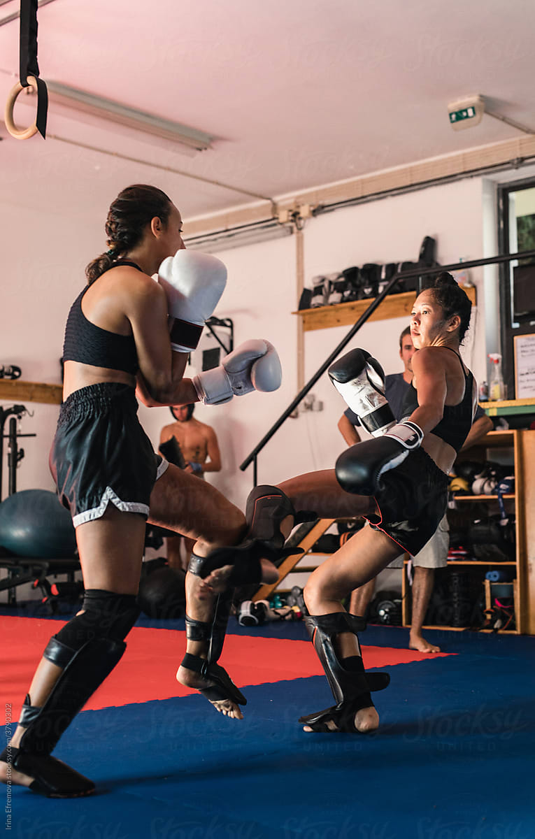 Thai Female Muay Thai Athlete Kicking The Opponent