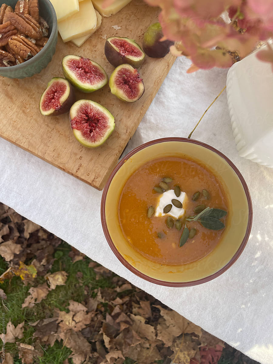 UGC of beautiful Fall table with pumpkin soup