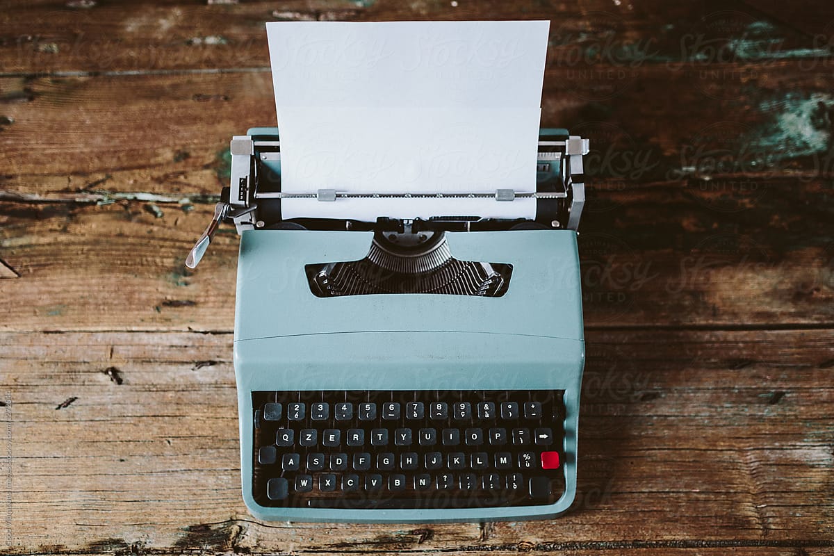 Vintage Typewriter And Paper Stack by Stocksy Contributor Ibex