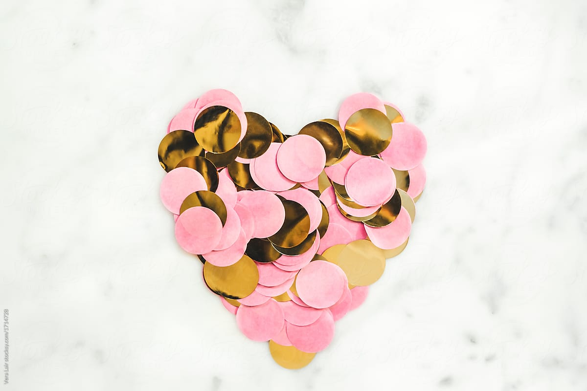 Heart made with pink and gold confetti