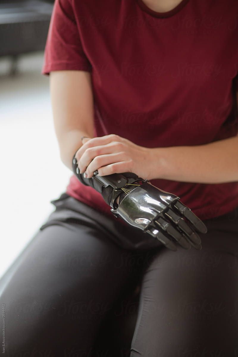 Diverse young woman with robotic bionic hand