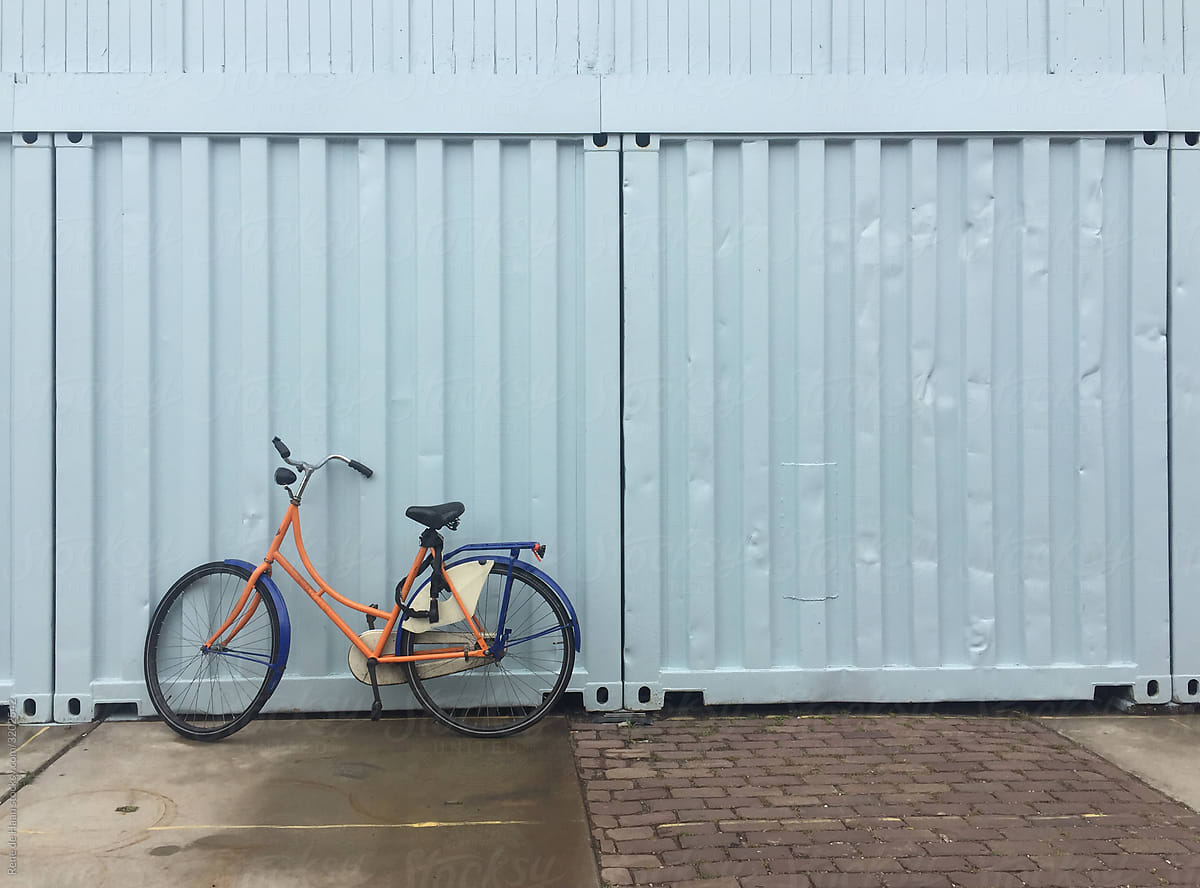 bicycle against blue wall