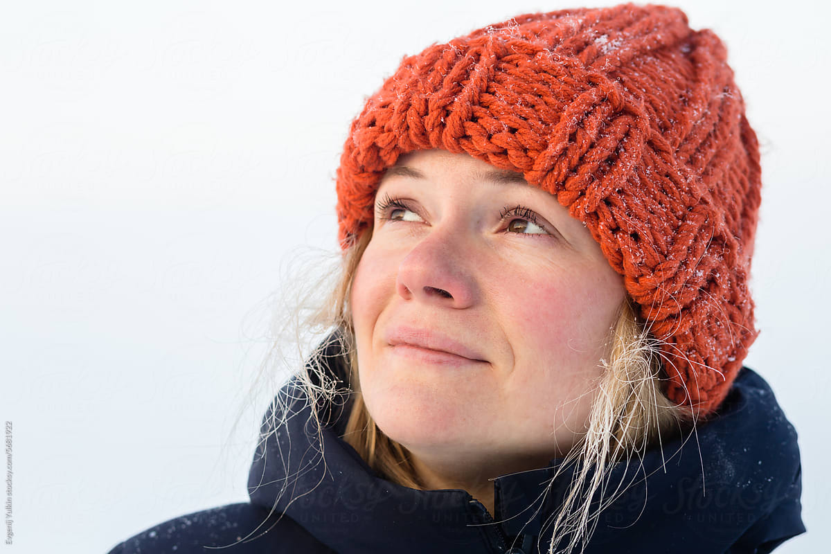 Beautiful woman in knitted hat in winter