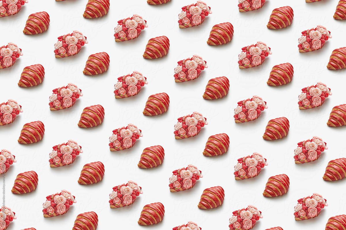 Pattern of croissants, raspberries and roses