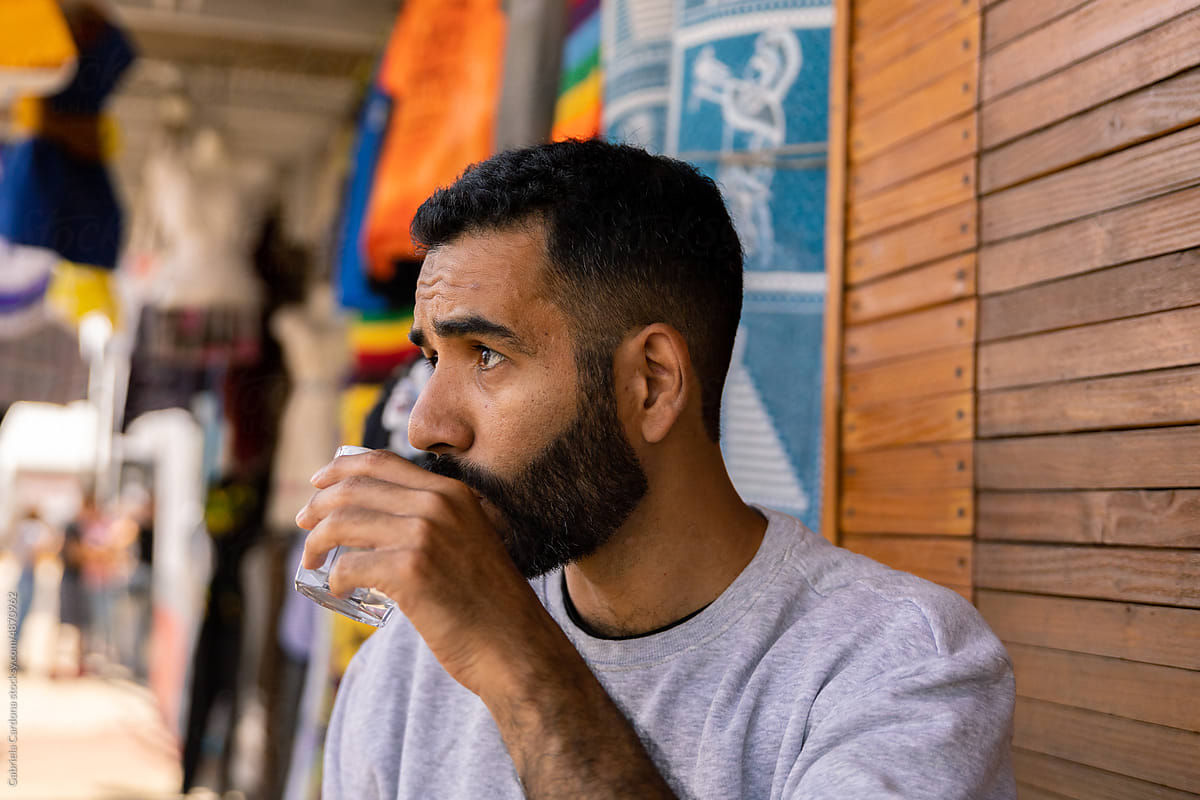 Portrait of a man drinking water