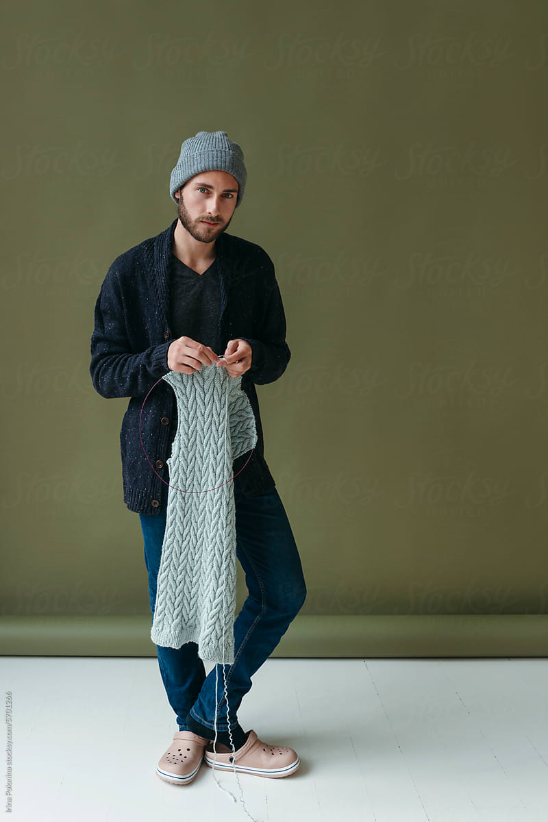 Knitting modern young male.