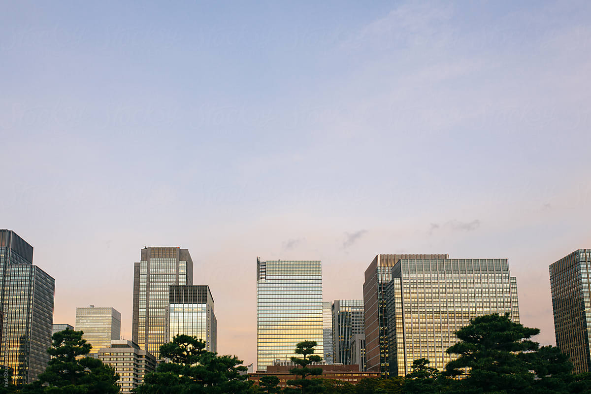 Modern buildings against the sky at sunset in the Tokyo city