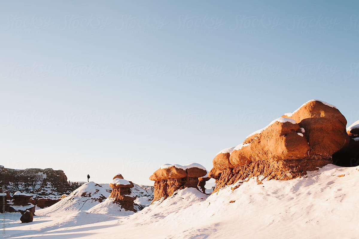 Snowy landscape in Utah in the winter with snow in the ground at Goblin Valley