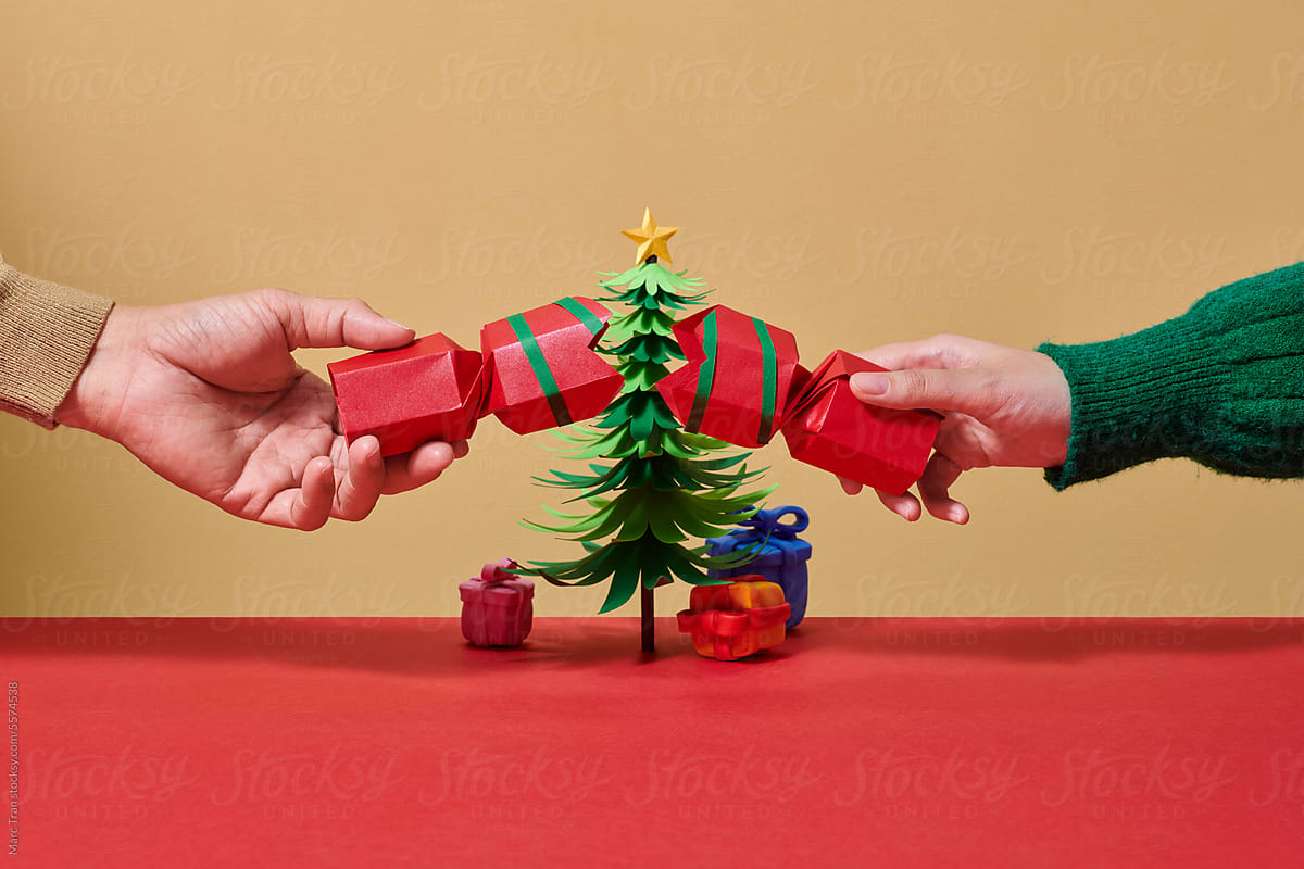 Hands holding Christmas gift box with as a present for Xmas