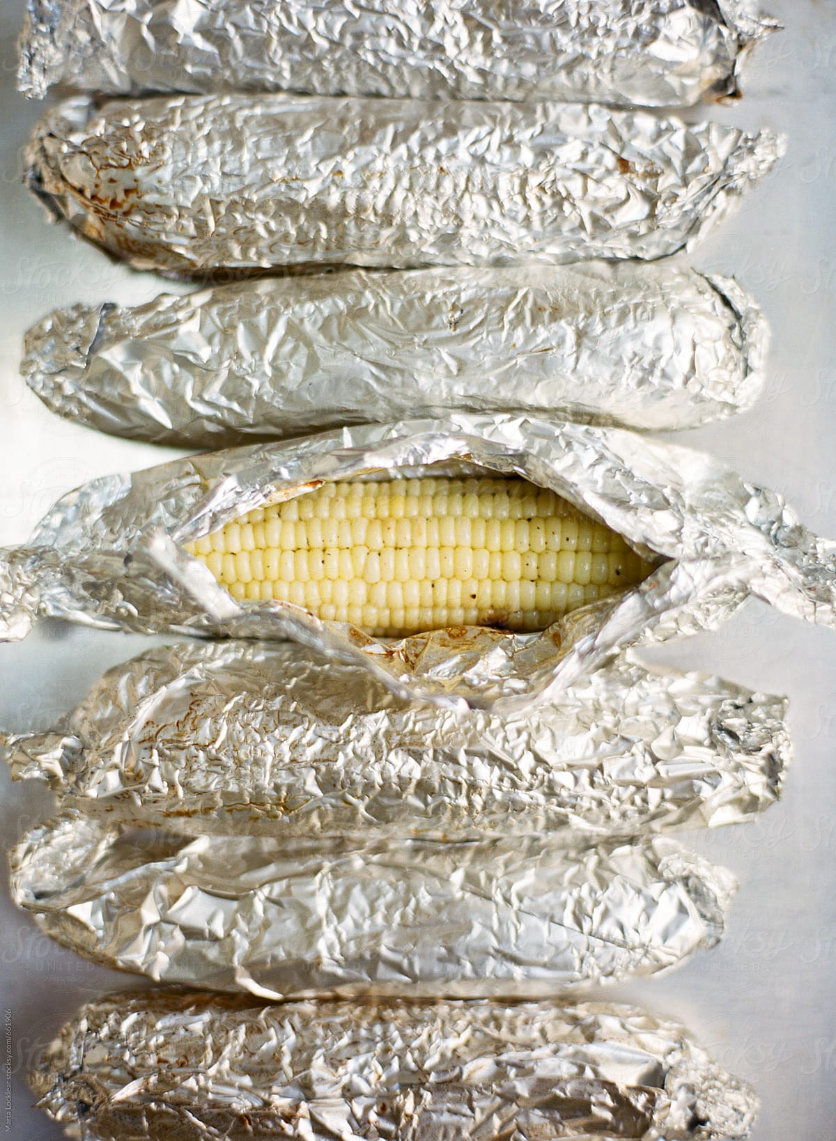 Corn on the cob cooked in aluminum foil