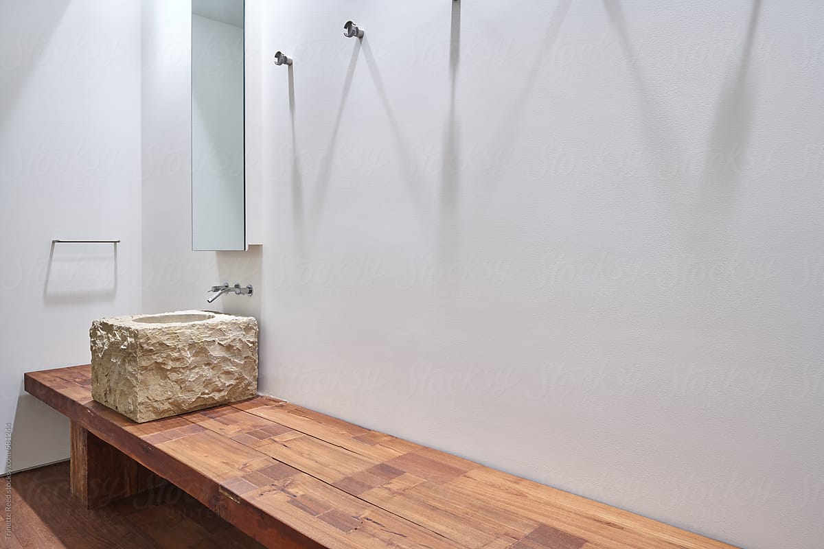 Minimal modern design luxury bathroom with stone sink