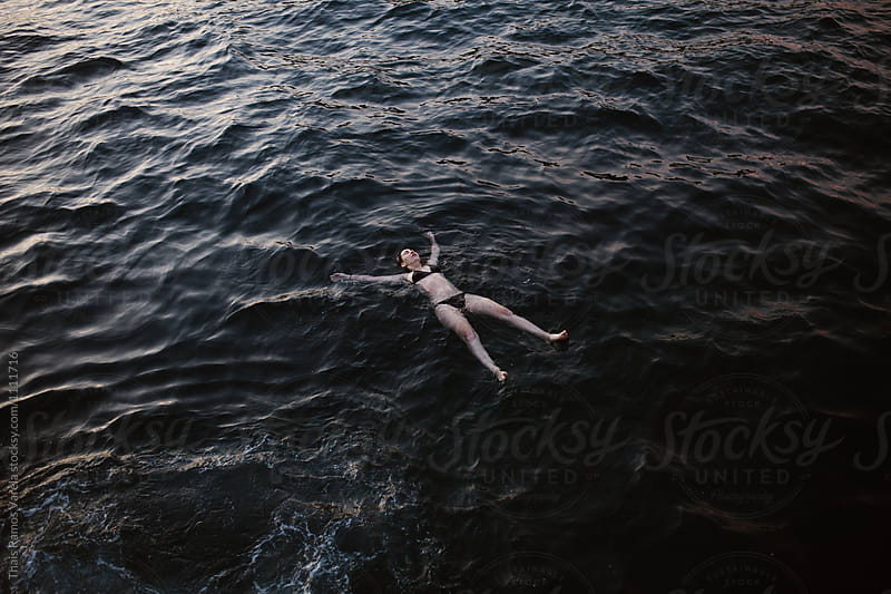 woman floating in the sea