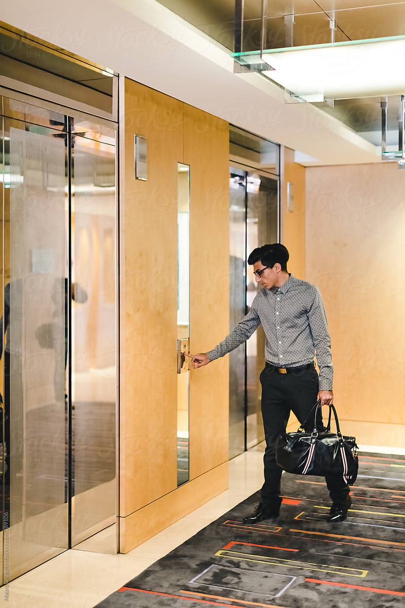 Businessman using elevator at the office