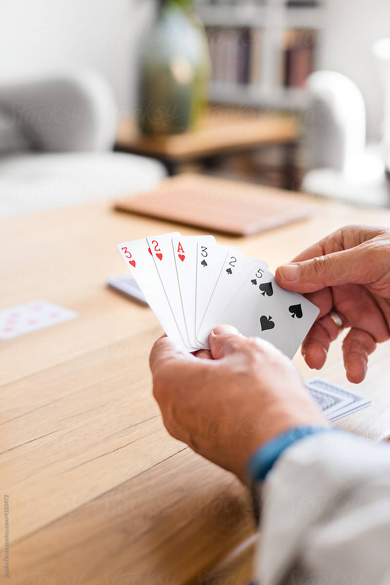 Senior Man Playing Cards