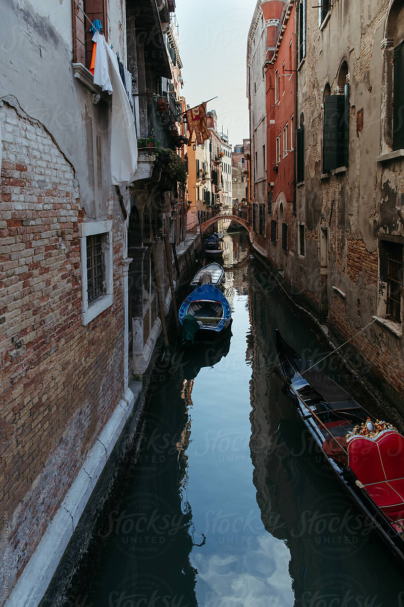 Reflections of old houses in the water in Venice.