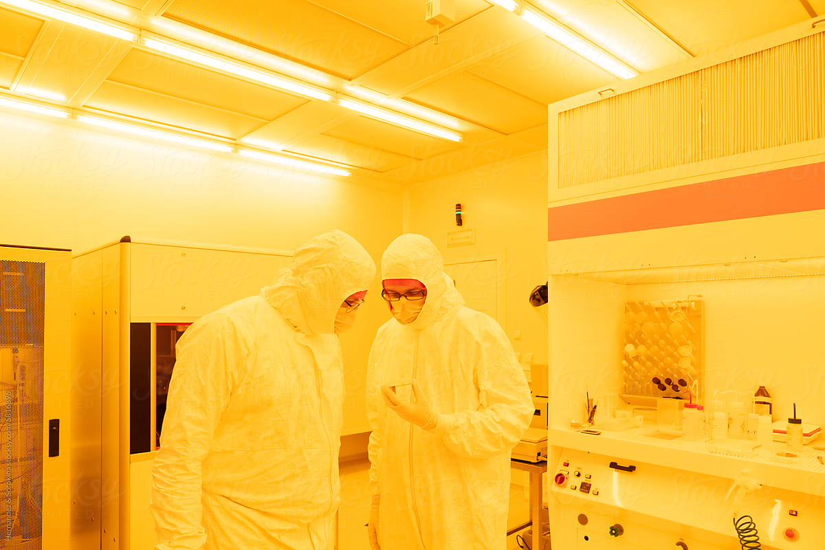 Scientists Working At Clean Room In The Laboratory