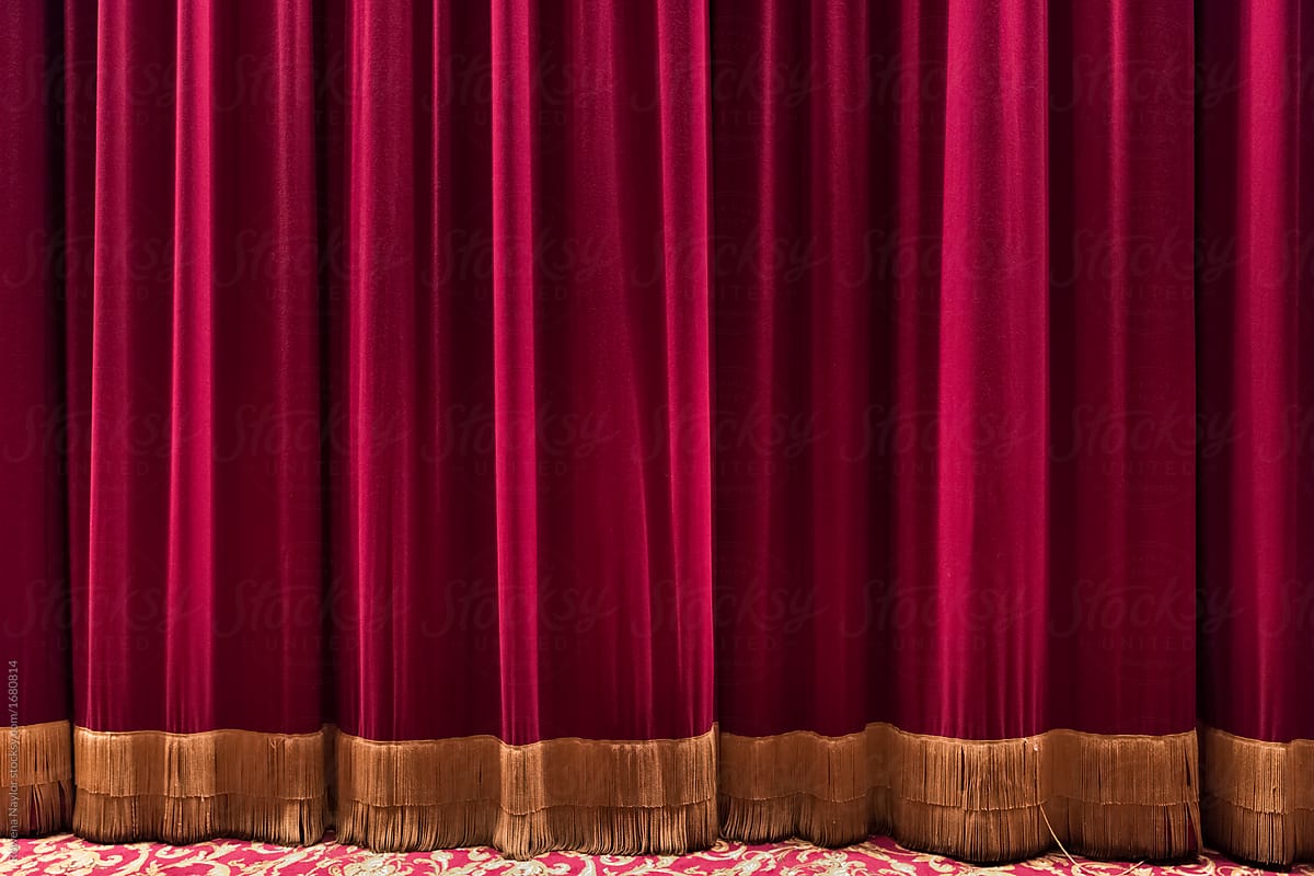 Large red drawn curtain of theatre