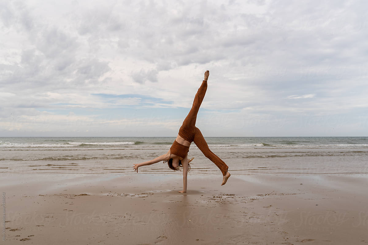 cartwheel woman at beach