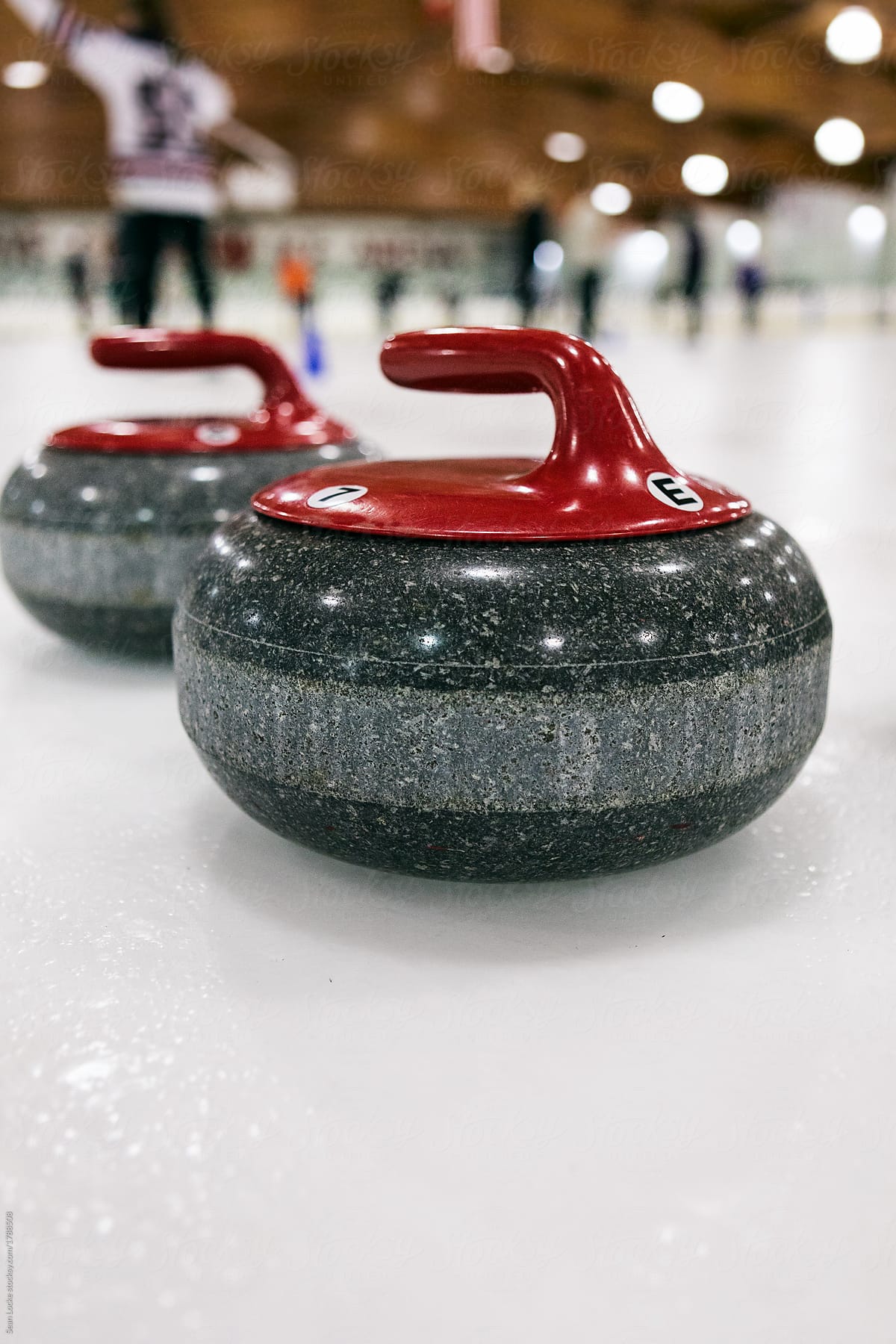 Curling: Red Team Stones Wait On Ice