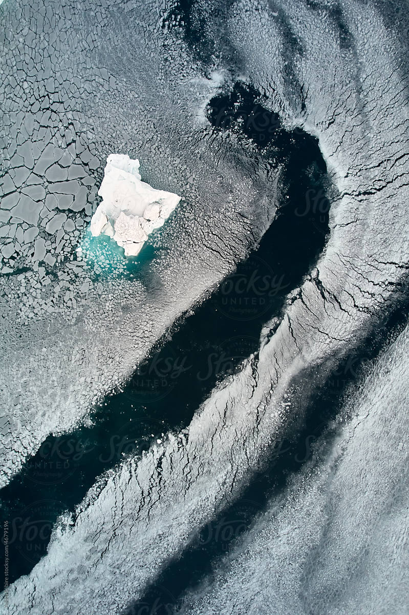 Greenland aerial shot, sea ice fragments, melting Arctic cryosphere