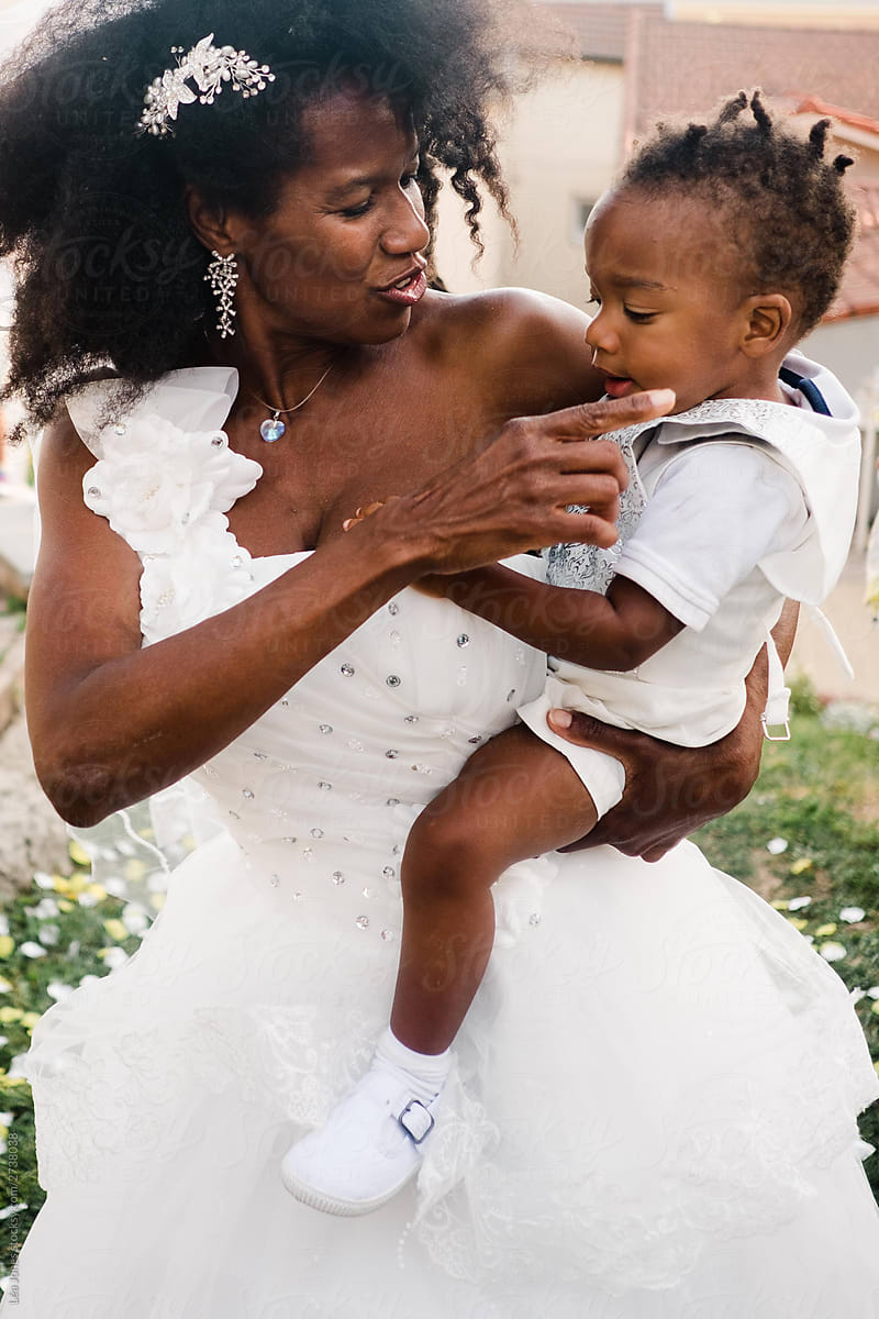 bride holding her baby