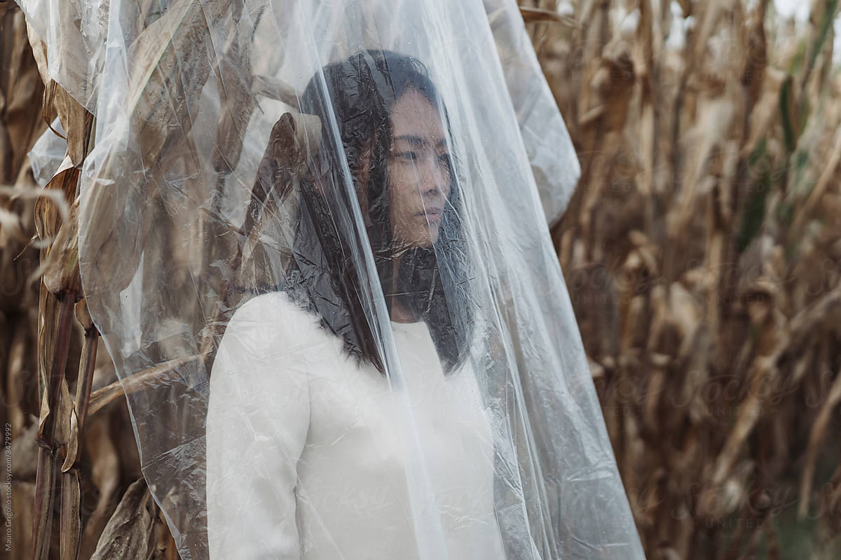 Asian woman In Nature Covered With Plastic. Isolation
