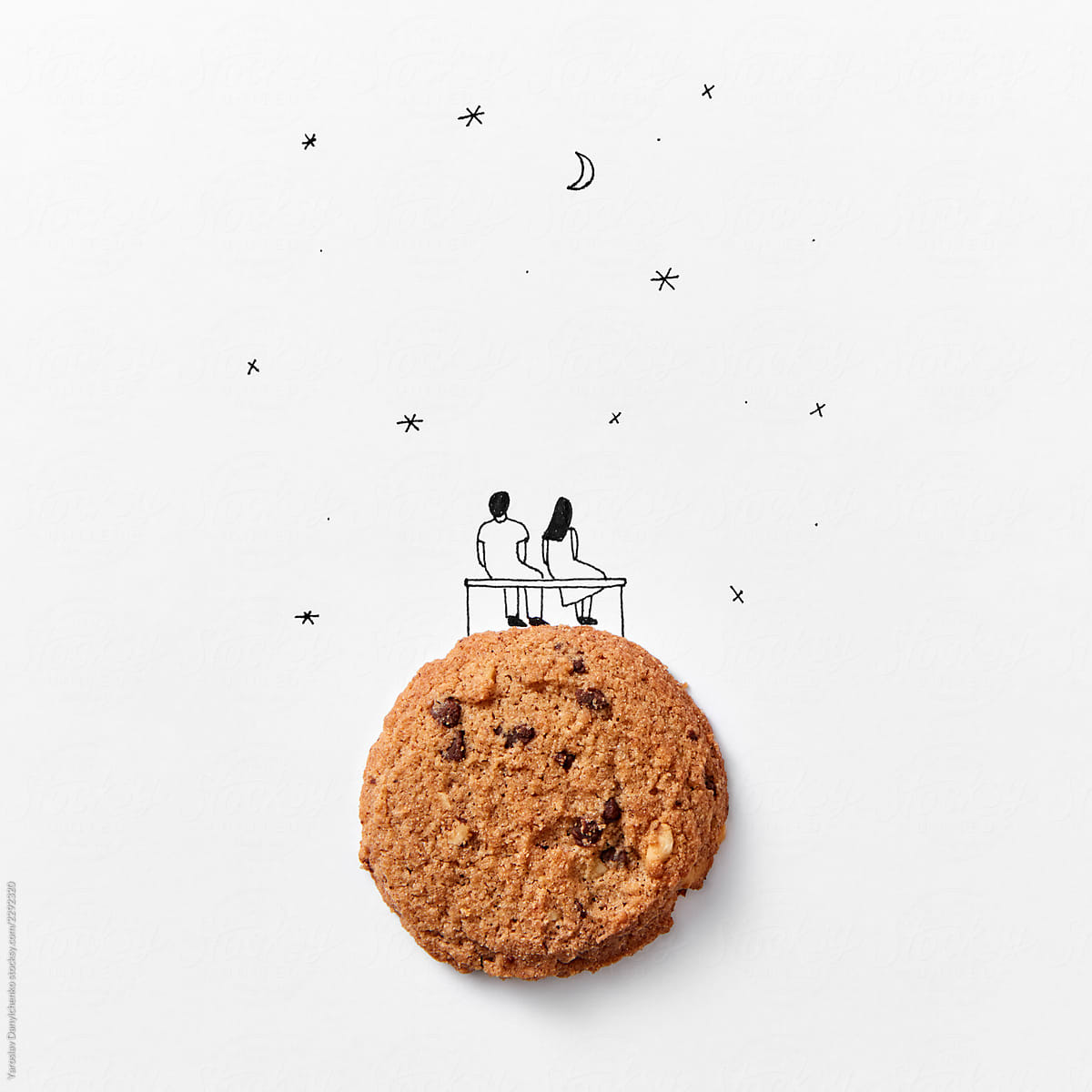 Cookies with a drawn man and woman on a background of the starry