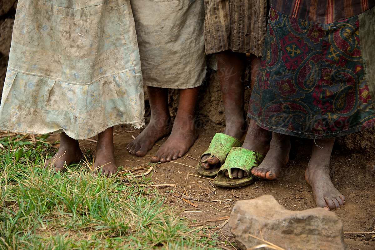 The small dirty feet of young village children, Uganda, Africa