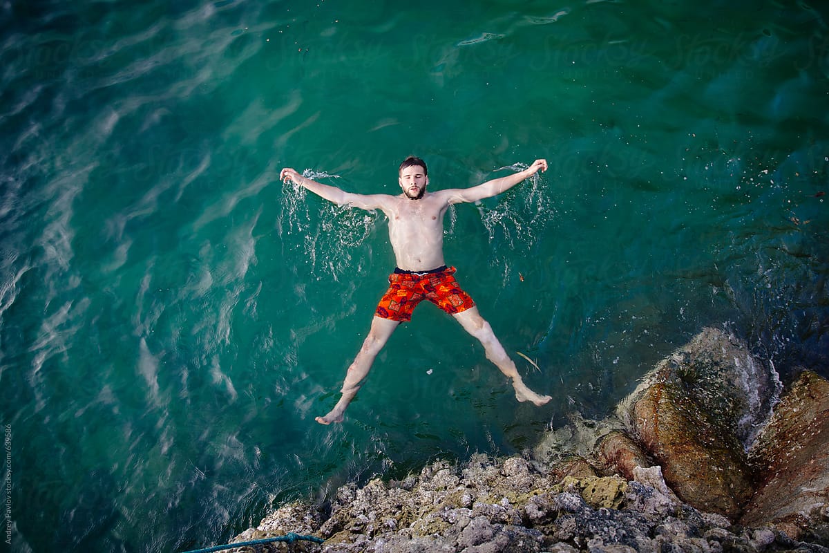 Man Lying At The Sea By Stocksy Contributor Andrey Pavlov Stocksy man-lying-at-the-sea-by-stocksy-contributor-andrey-pavlov-stocksy