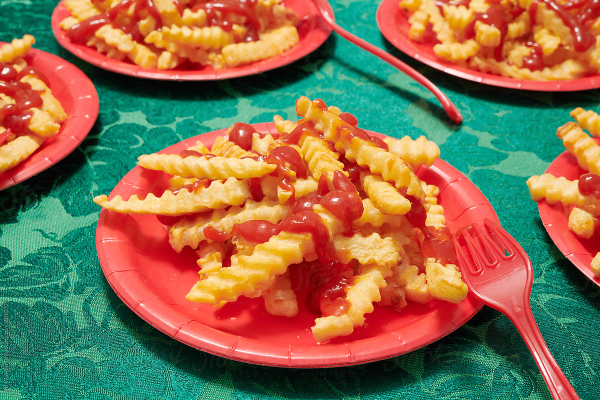 French Fries with Ketchup and Ketchup on Plates