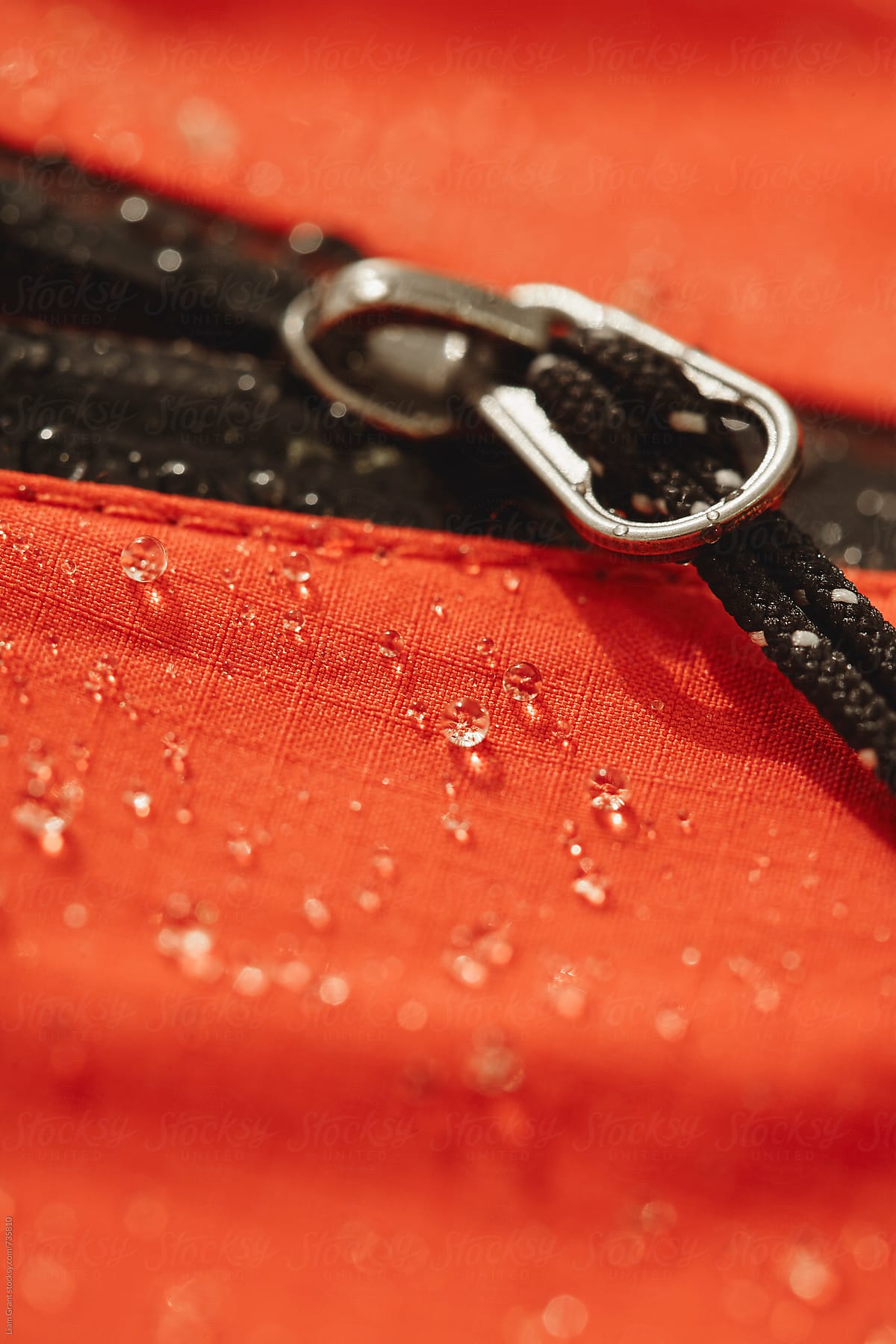 Waterproof zip and fabric of a hardshell mountaineering jacket.