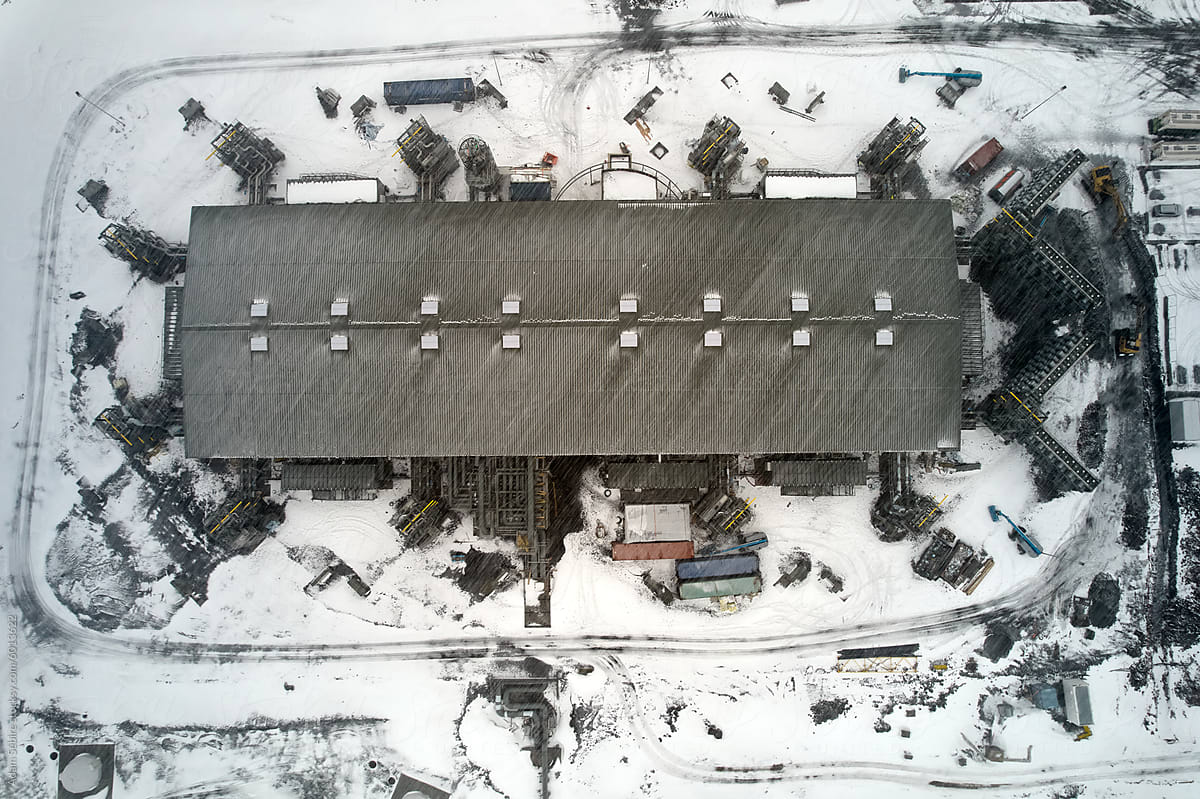 Mammoth carbon capture and storage plant - overhead aerial in blizzard
