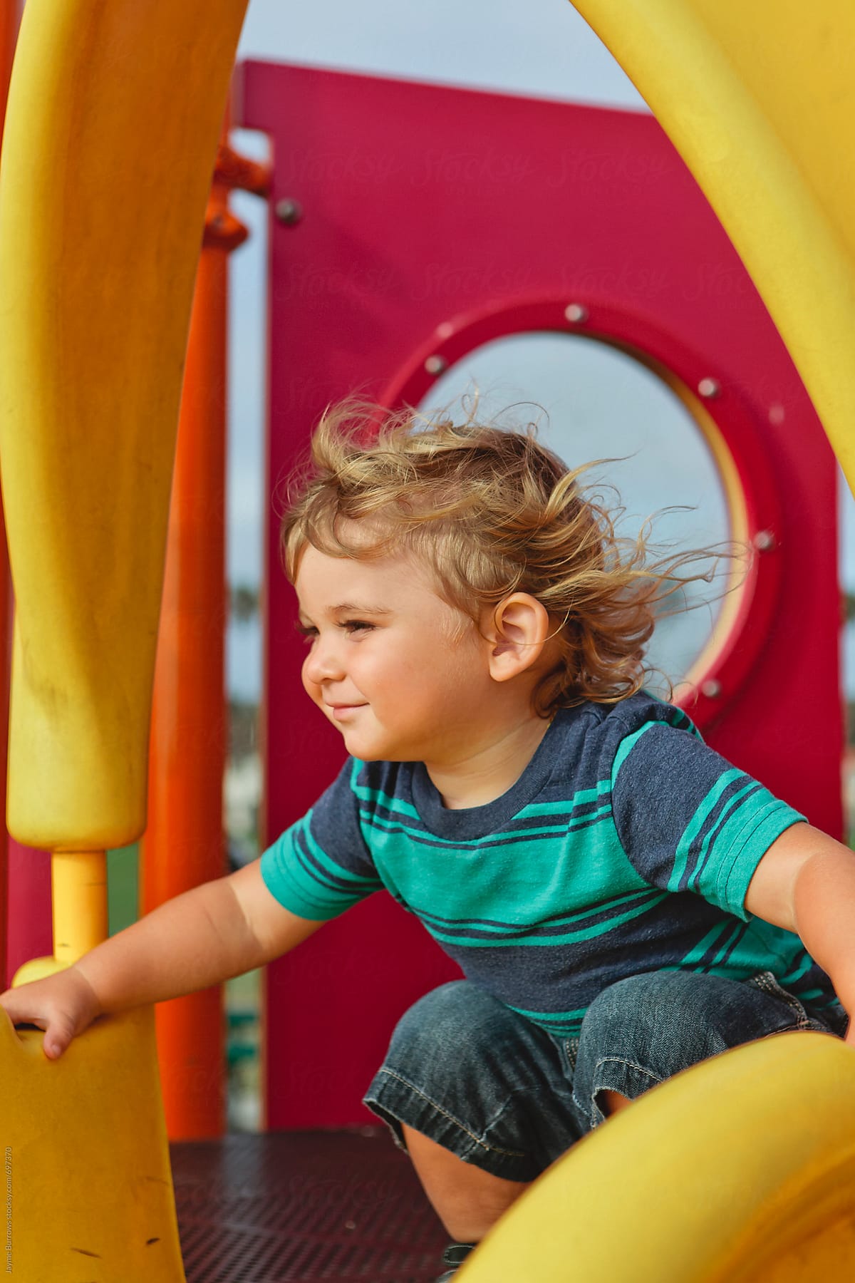Portrait of a Toddler on Top of Colorful Playground