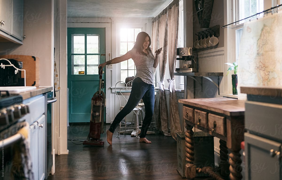 Tunes: Woman Dances To Music With Vacuum