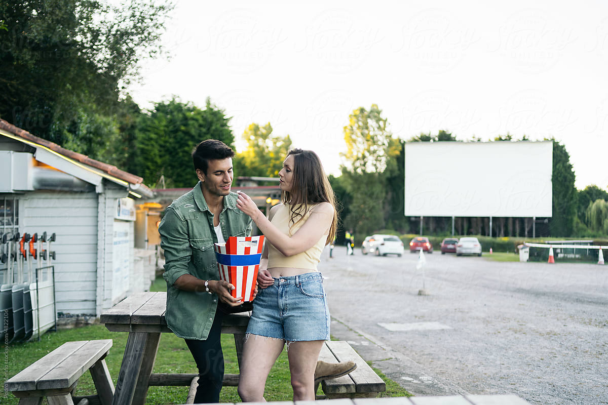 Couple having a date at the drive-in cinema