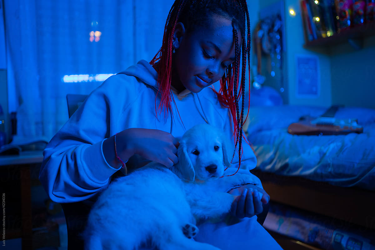 Teen Black Girl With Her Little Dog In Her Bedroom.