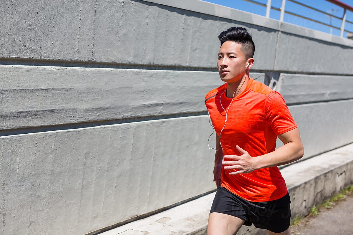 Young Chinese Man Running In A Modern City by Giorgio Magini - Asian,  Athlete