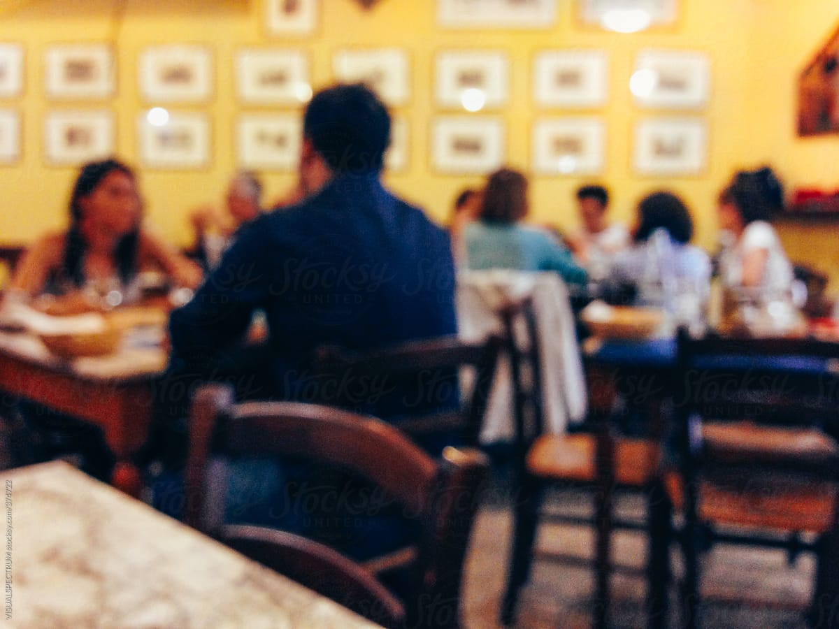 People Eating in Italian Restaurant Defocused